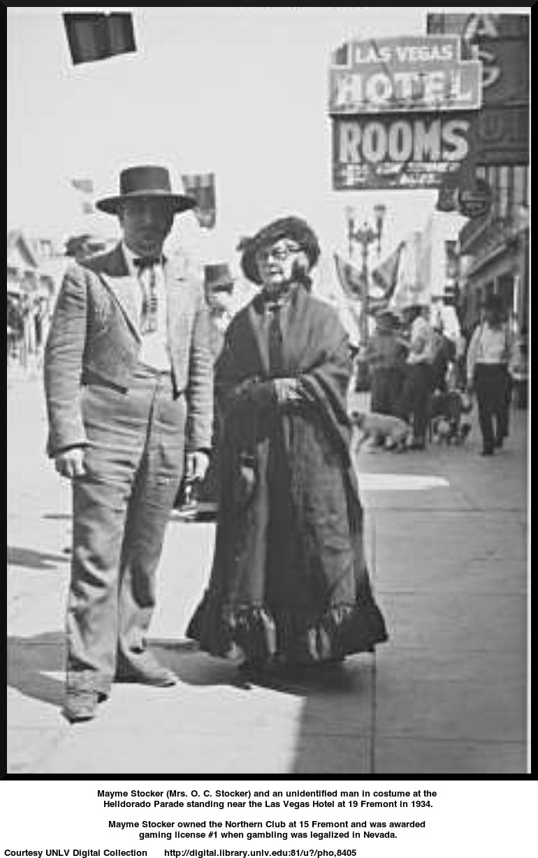 Mayme Stocker (Mrs. O. C. Stocker) and an unidentified man in costume at the Helldorado Parade
standing near the  Las Vegas Hotel at 19 Fremont in 1934.